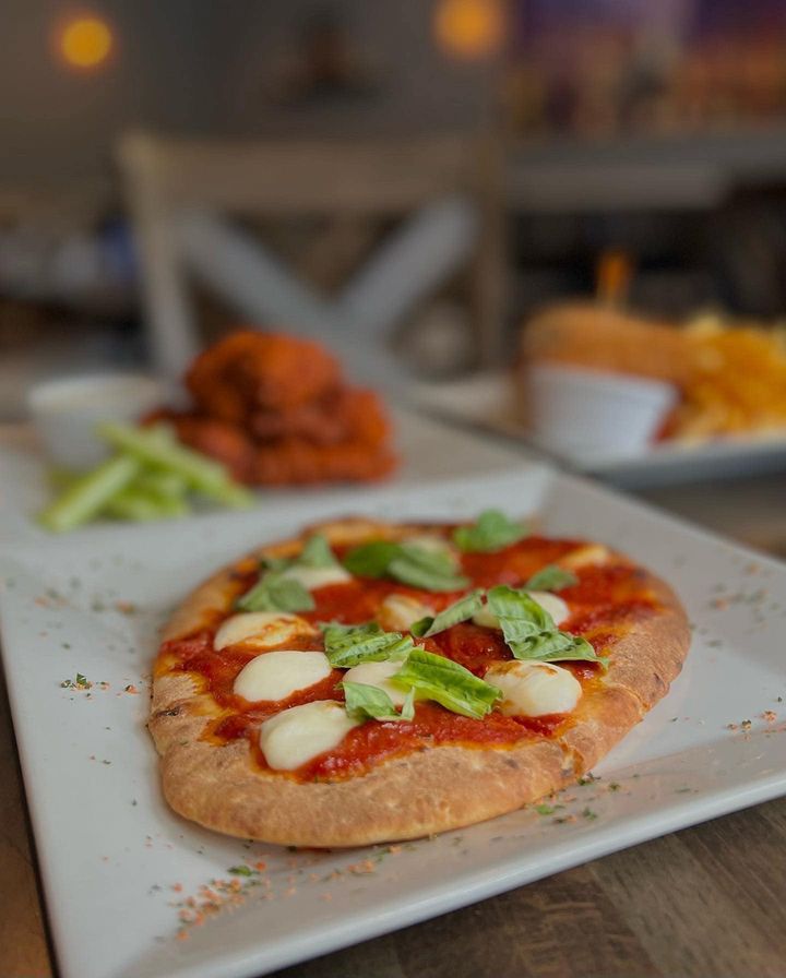 Vera Roma is now offering our bar menu to the entire bar area! We have a great selection of foods such as our 10 piece wings, margarita flatbread and chicken parm sandwich, as pictured. Come in and try out the bar menu! This menu is available starting at 3:00pm Tuesday - Sunday